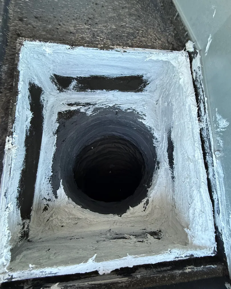 Fresh sealant around a rooftop duct connection, sealed by Elevate